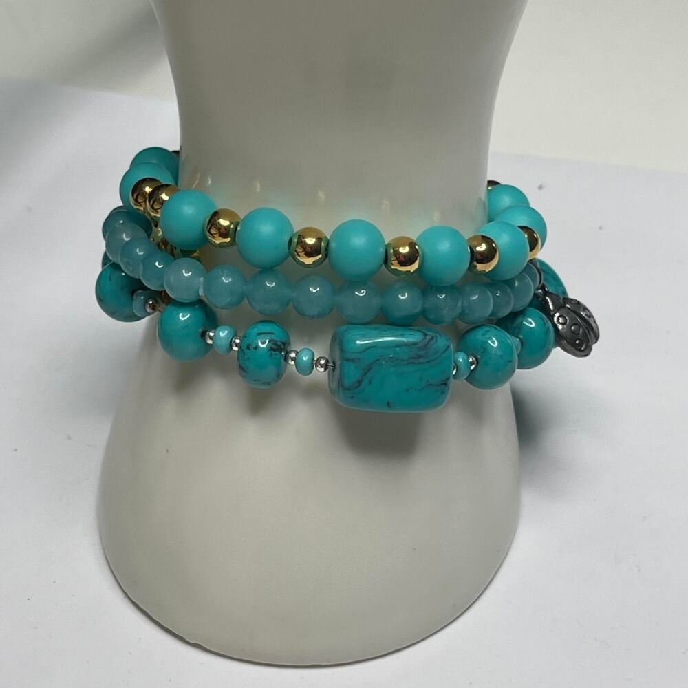 Beaded stretch bracelet set of 3 turquoise blue with some gold tone beads